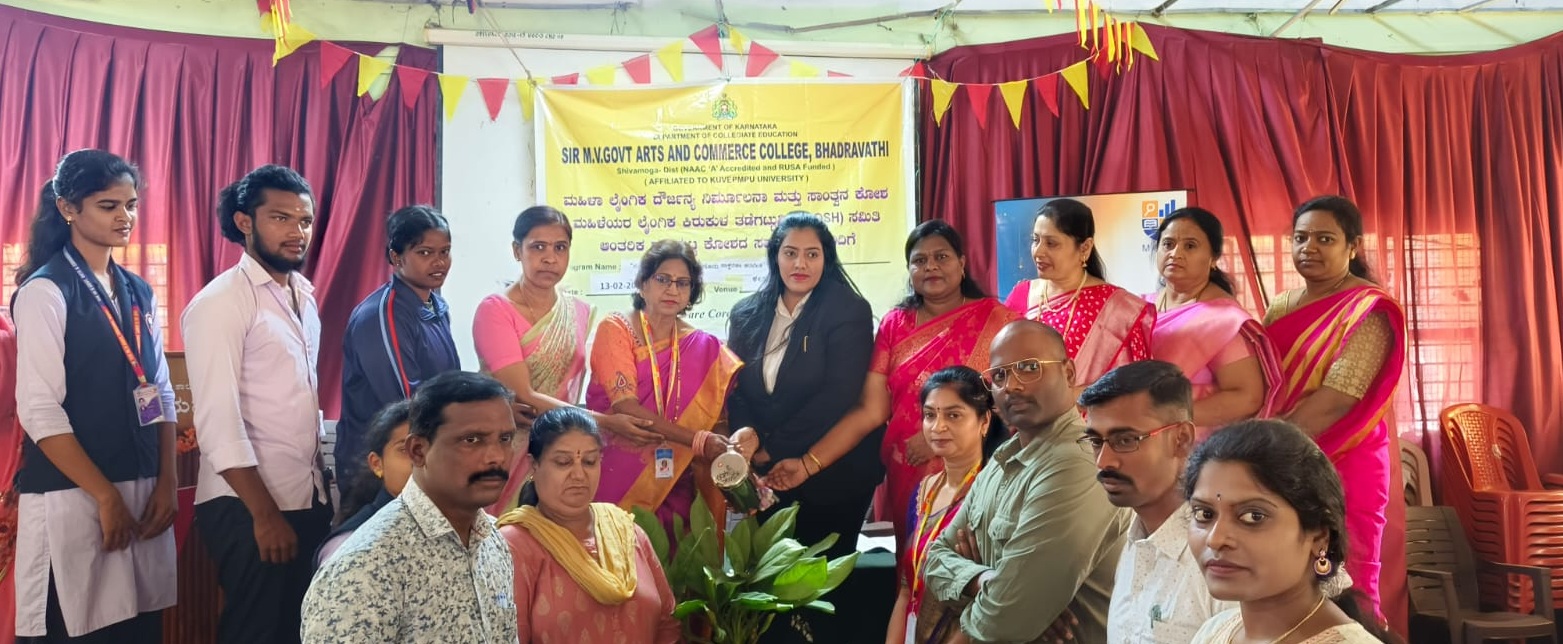 Full hall view of students attending